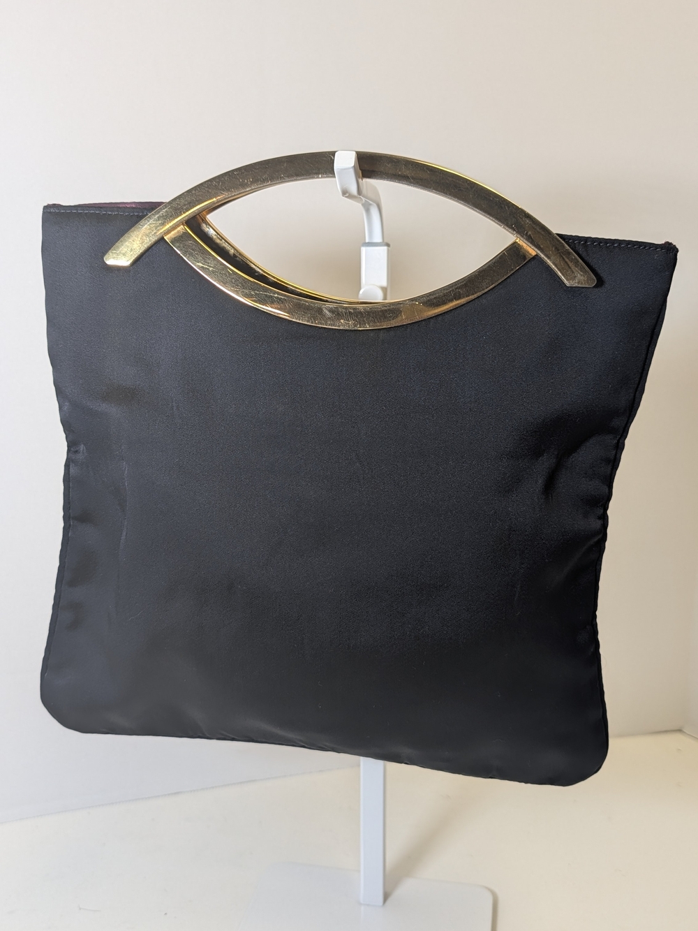 Elegant Black Satin Clutch with Gold Arc Handle
